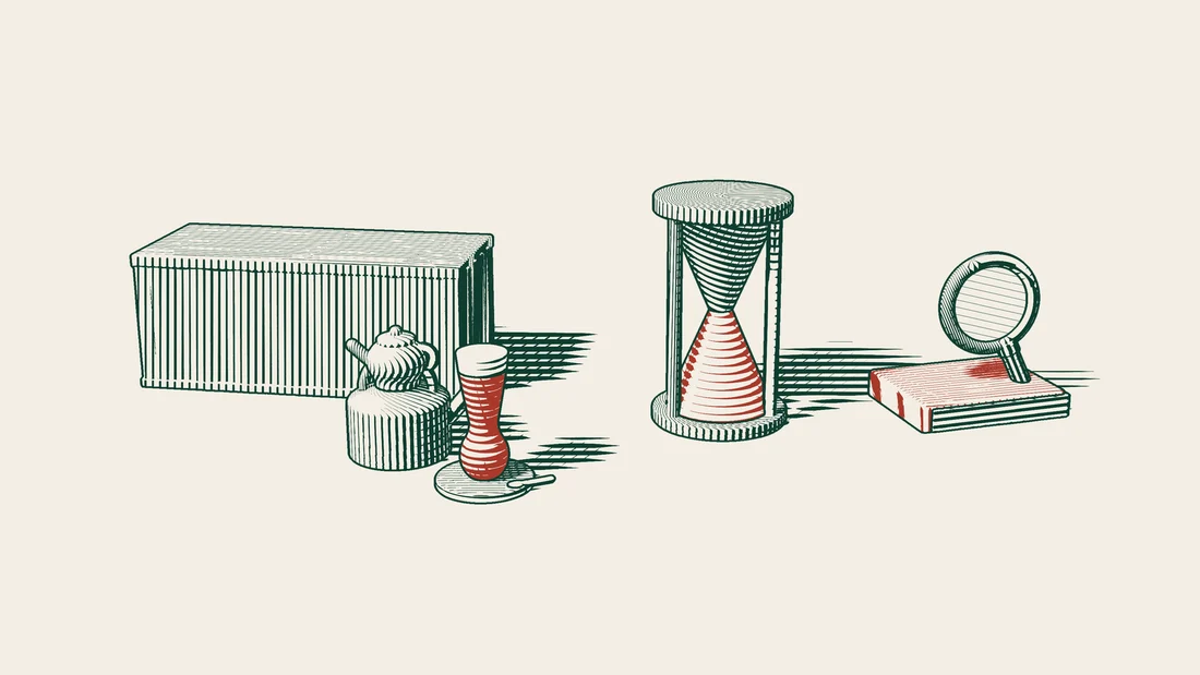 A shipping container, an hourglass whose sand has run out, and a magnifying glass resting on a red-bound book, with a Turkish tea set in front.