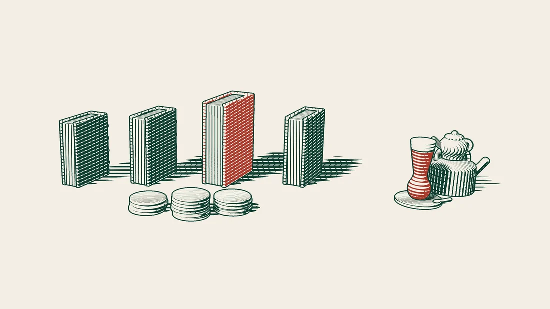 A red-bound book stands among three green-bound books, with three coin stacks in front and a Turkish tea set to the right.