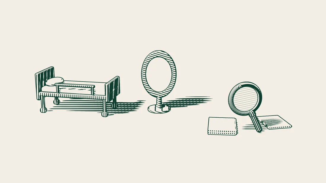 Stacks of blank medical records with a magnifying glass on top, set in front of a patient bed and a standing mirror.