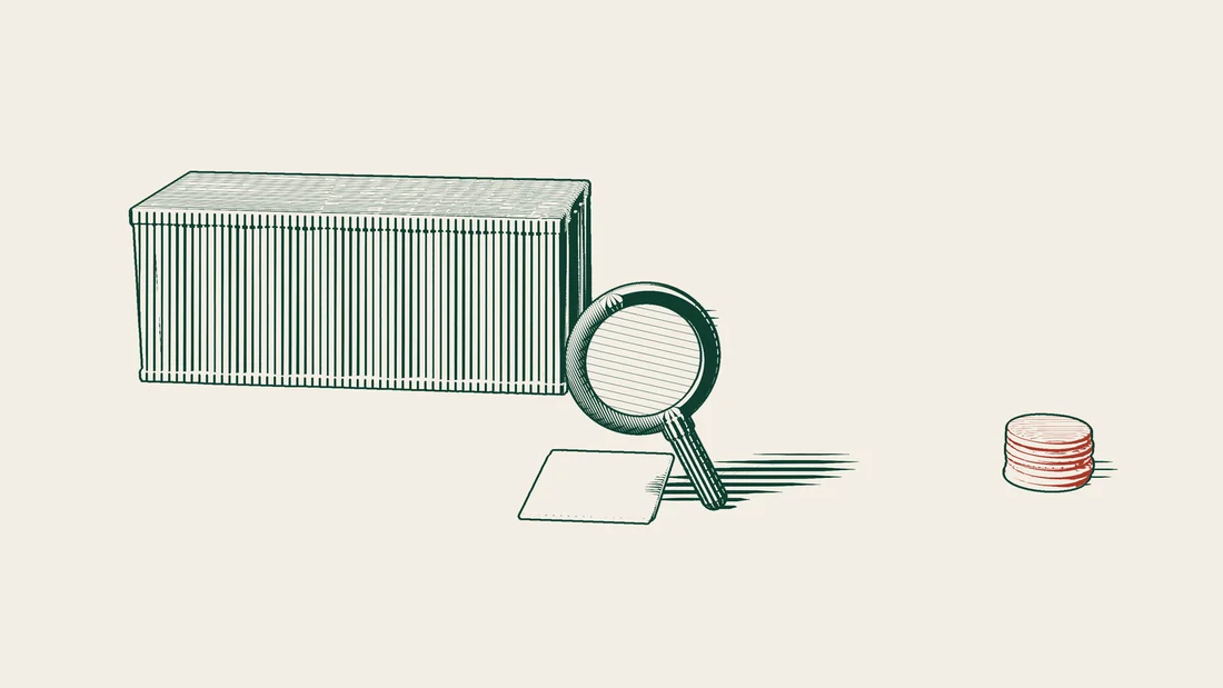 A magnifying glass over a blank customs document in front of a shipping container, beside a red stack of coins.