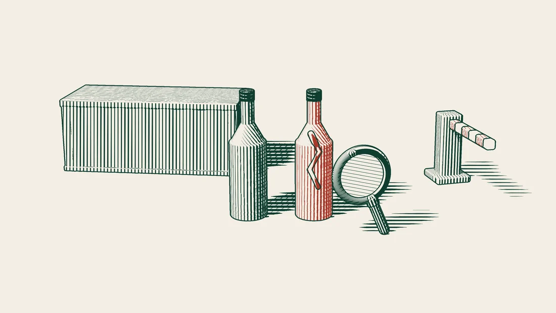 Two similar bottles in front of a container and a closed barrier, with a magnifying glass over the red, cracked one.