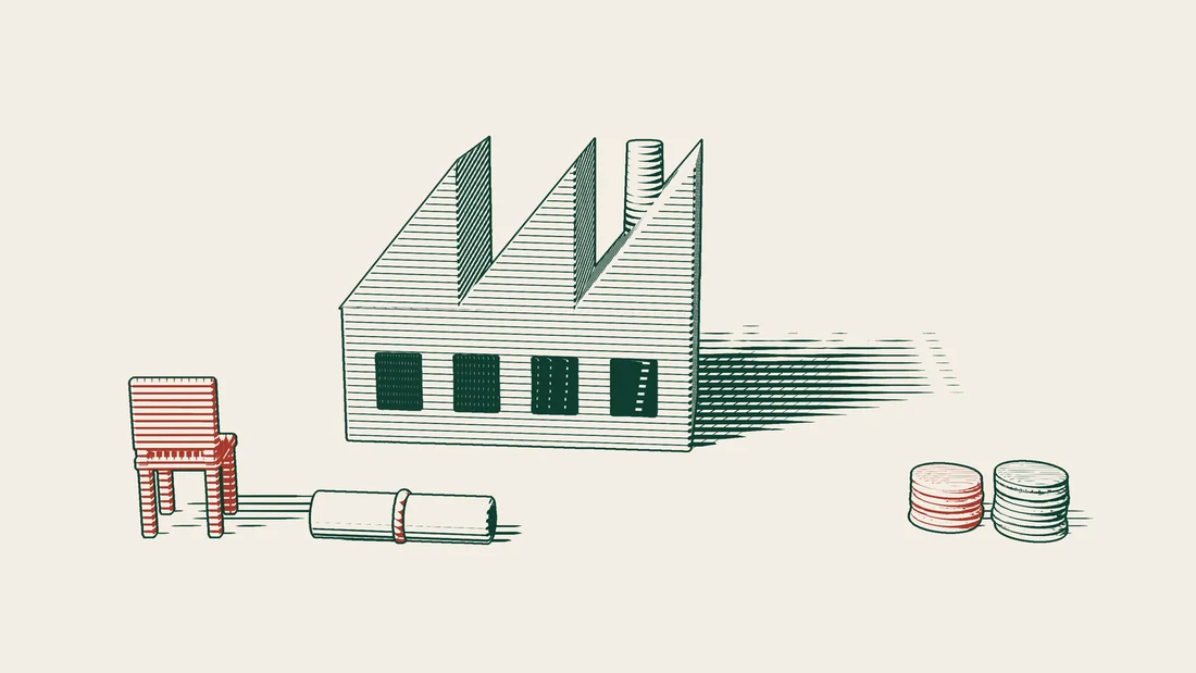 A red chair and a ribboned document stand in front of a factory, with large red stacks of coins on the other side.