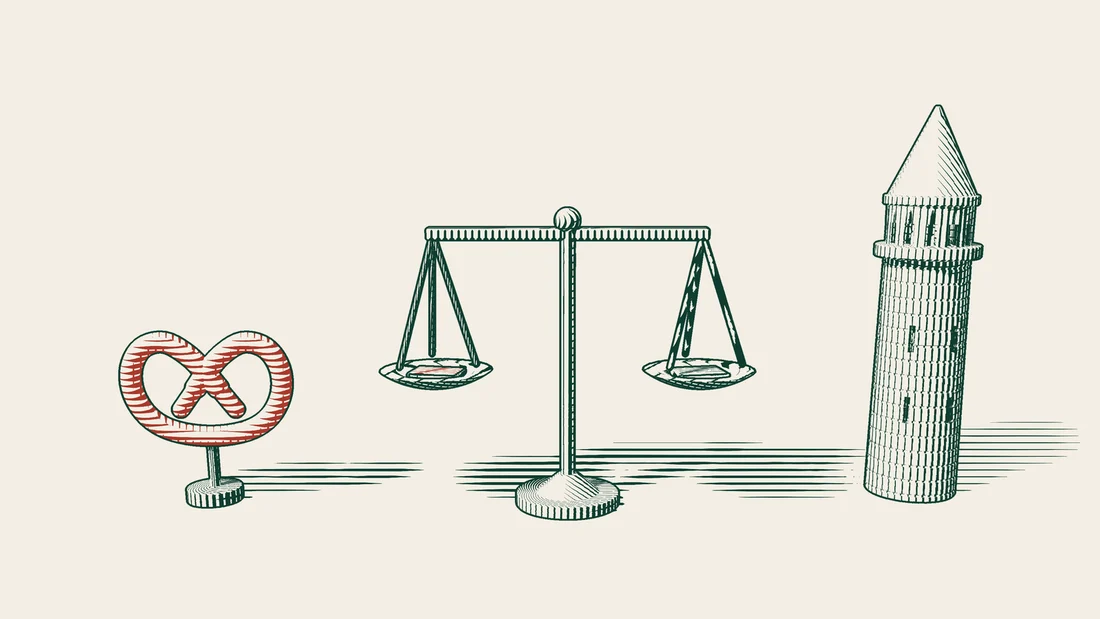 A balance in level position with a closed book on each pan, standing between a red pretzel and an Istanbul stone tower.