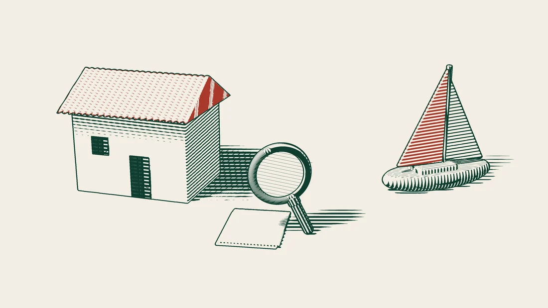 A magnifying glass over blank sheets of paper in front of a villa, with a sailing yacht in the distance.