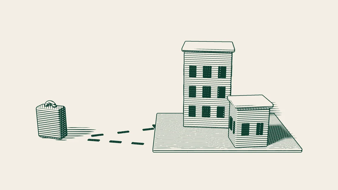 Arrows lead from a suitcase to a large company building and a smaller branch building standing on the same ground.