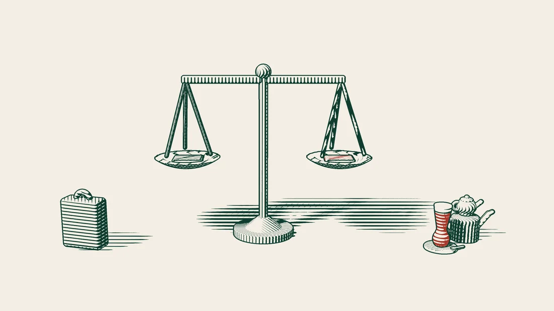 Two books resting on the pans of a set of scales, with its beam perfectly level.