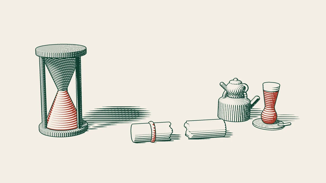 An hourglass whose sand has run out stands beside a ribboned certificate torn in two, with a Turkish tea set to the right.