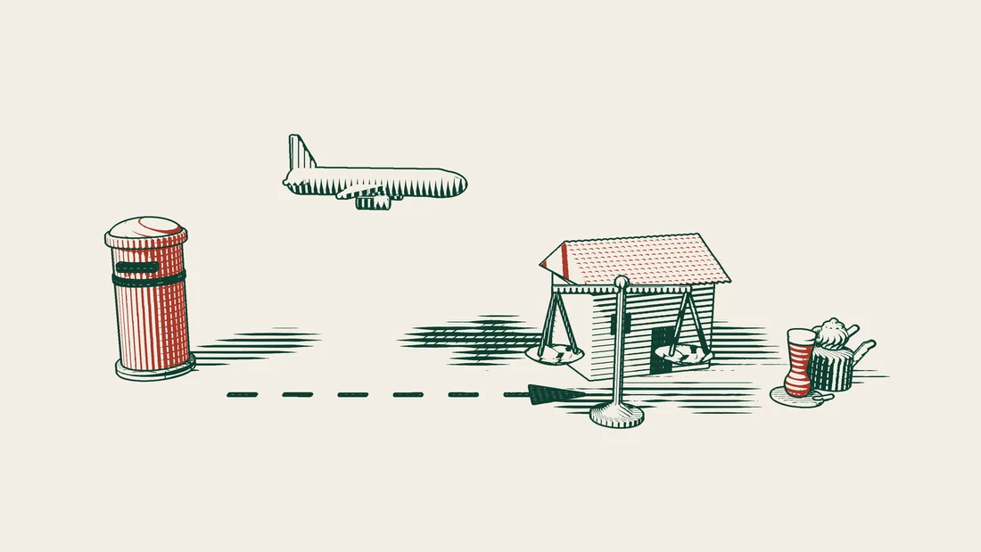 An aeroplane rises from beside a red postbox and flies towards a tiled-roof house, with a balance and a Turkish tea set next to the house.