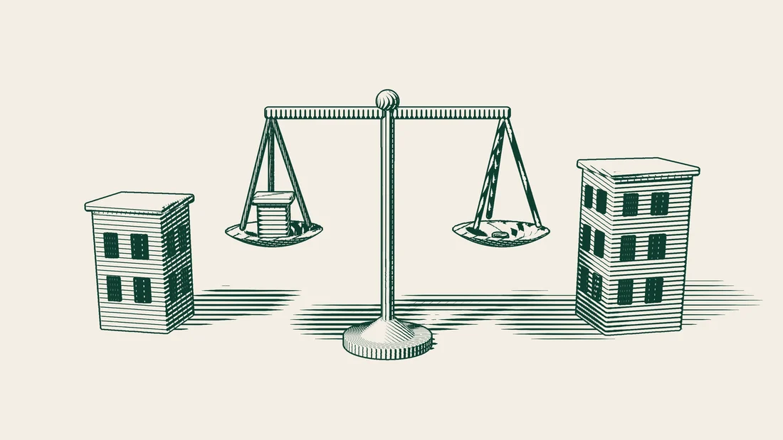 A pair of scales with a small office building in one pan and stacks of coins in the other.