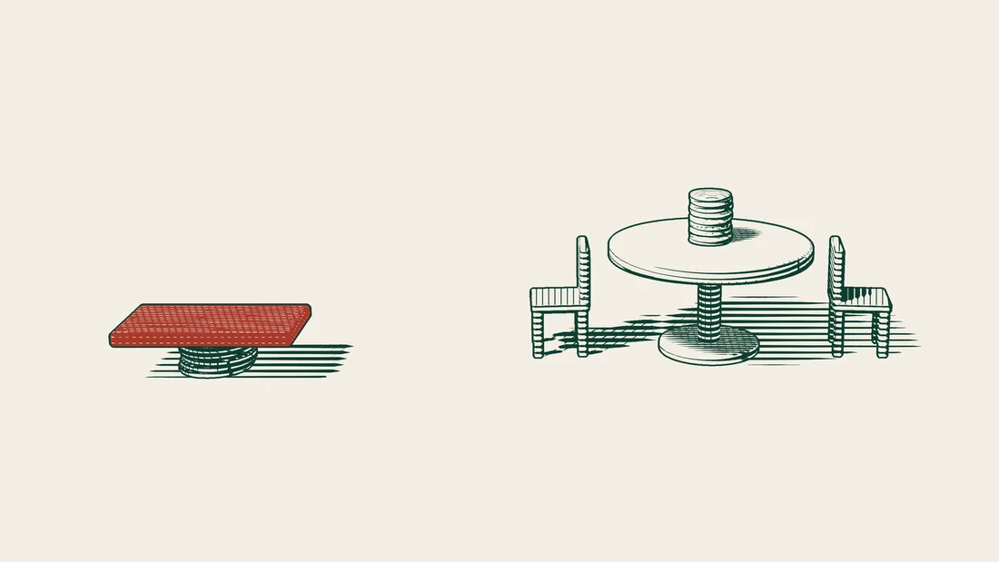 A short coin stack under a red slab on the left, and a round table with two empty chairs and a coin stack on top.