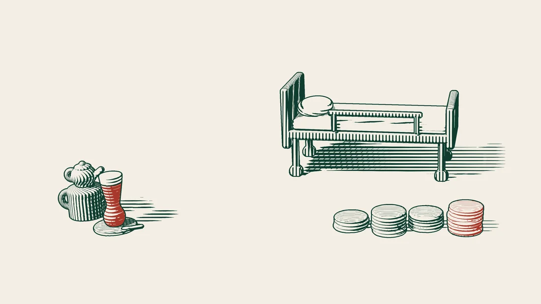 Stacks of coins of different heights stand in front of a hospital bed.