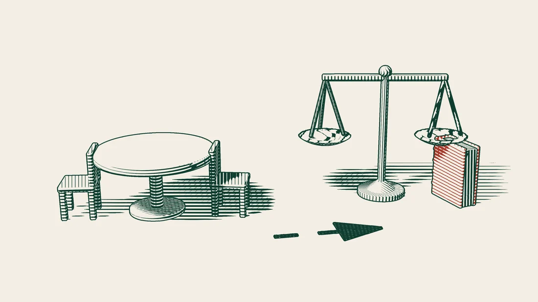A table with two chairs comes first, then an arrowed path leads on to scales and a red-bound book.