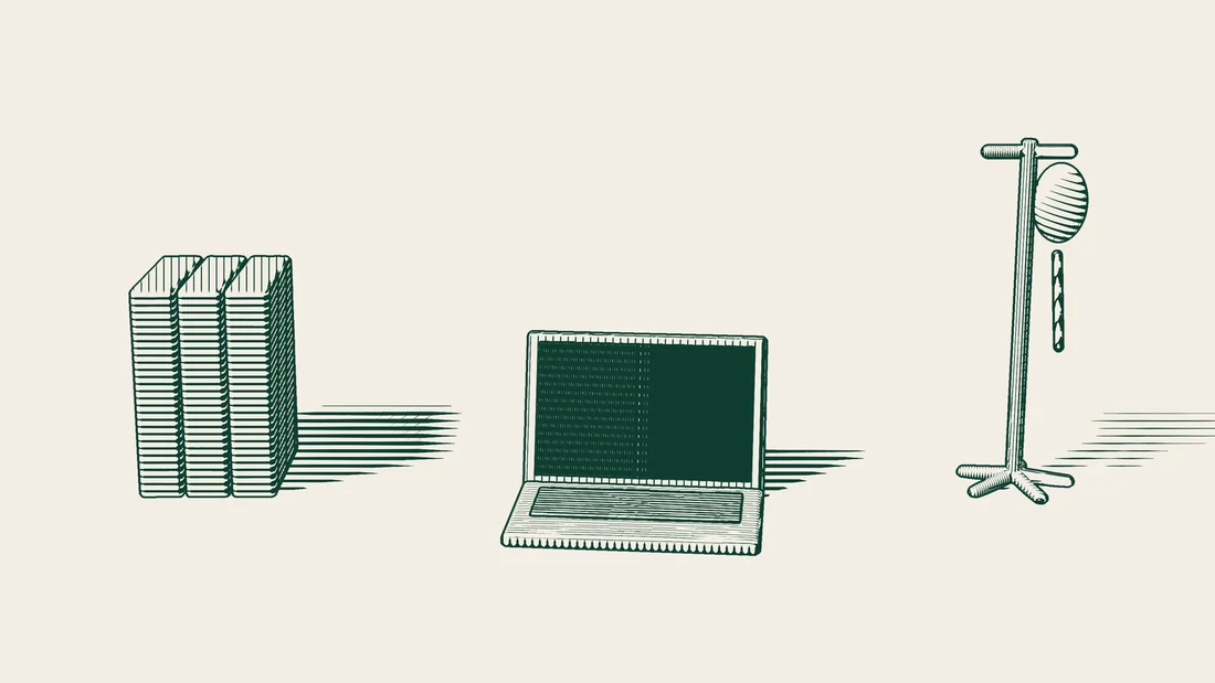 File folders and a closed laptop with a dark screen, with an IV drip stand beside them.