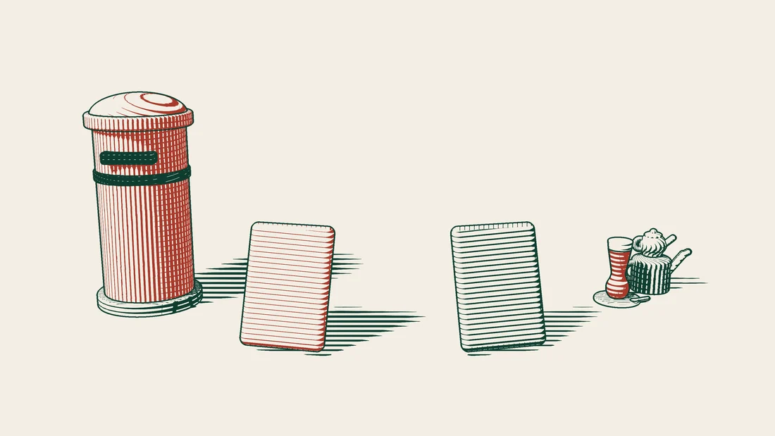 A red pillar box on the left, two large passport-style booklets standing side by side, one of them red, and a Turkish tea set on the right.