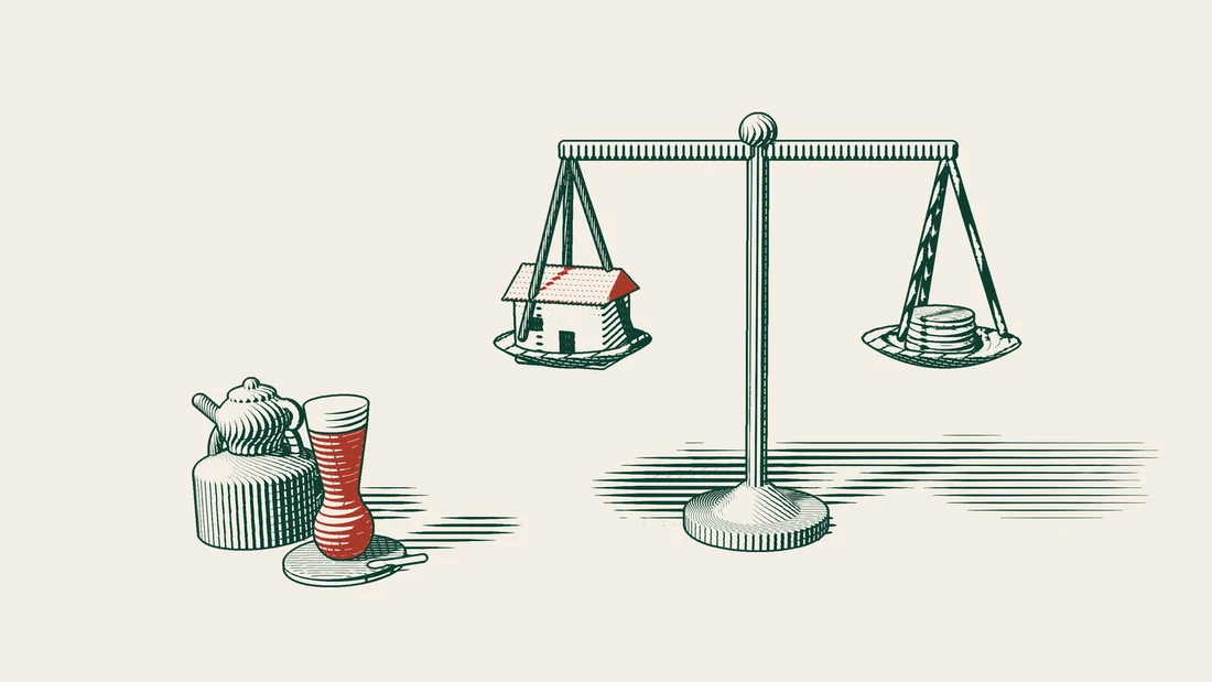 A pair of scales holds a small house in one pan and a coin stack in the other, the beam level, with a Turkish tea set to the left.