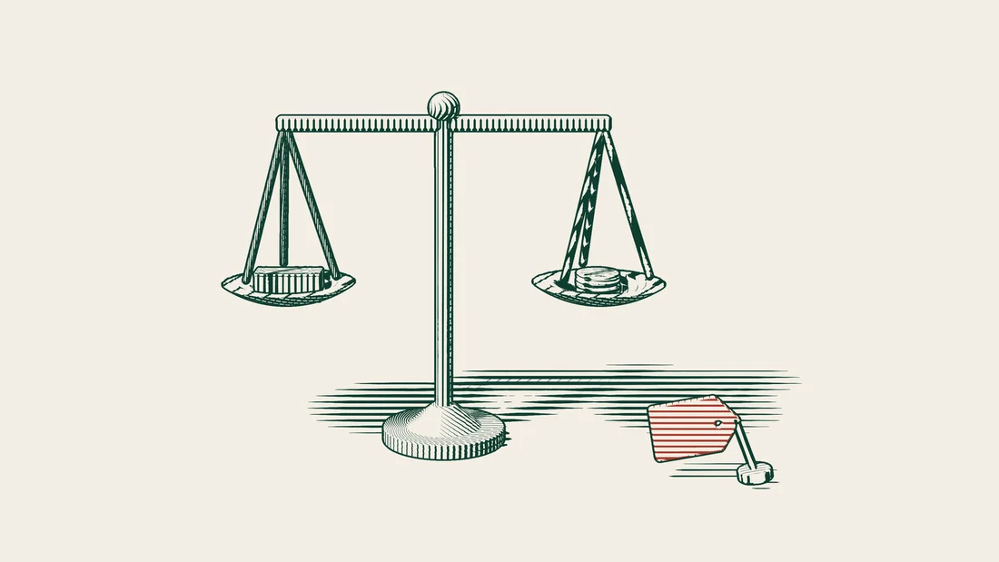 A scale holds a freight container in one pan and a tower of coins with a red tag in the other.