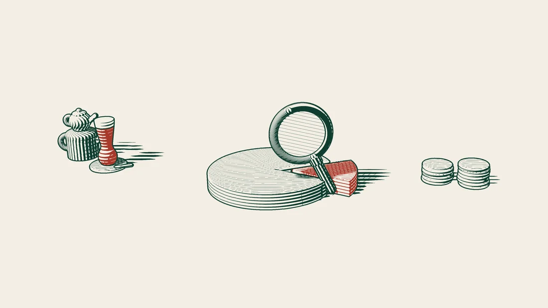 A magnifying glass examines a sliced disc and the stacks of coins beside it.