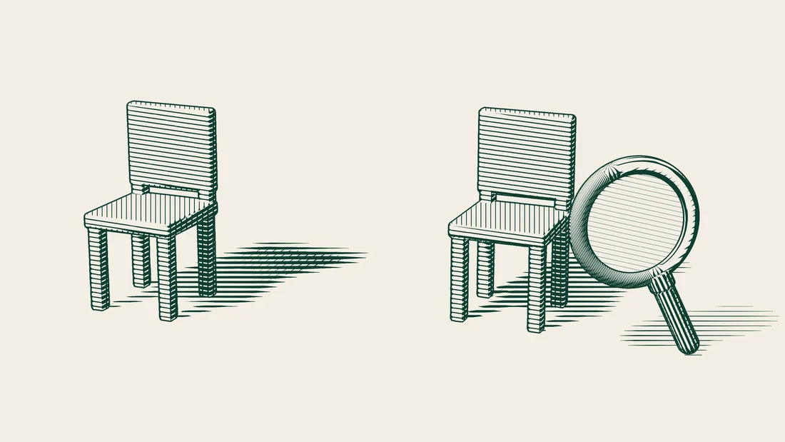 An original chair and its copy standing side by side, with a magnifying glass held over the copy.