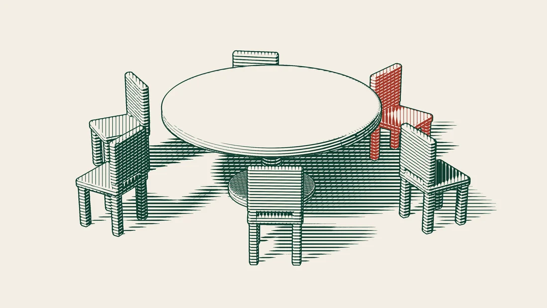 Six chairs set around a round table, five of them green and one of them red.